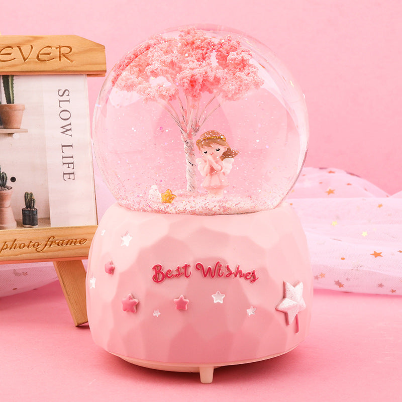 Clear close-up of snow globe interior with angel
