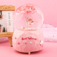 Clear close-up of snow globe interior with angel