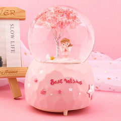 Base detail of cherry blossom snow globe music box