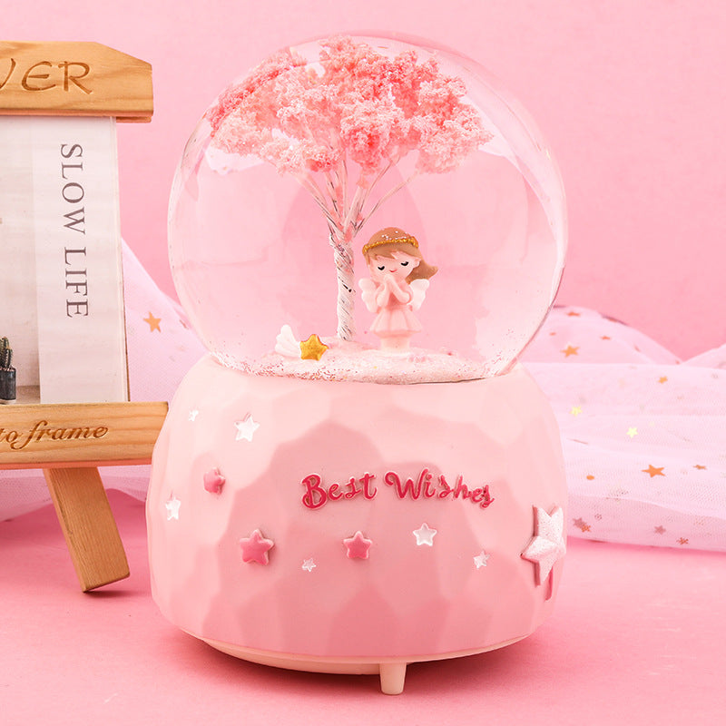 Base detail of cherry blossom snow globe music box