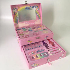 girl smiling while using makeup set