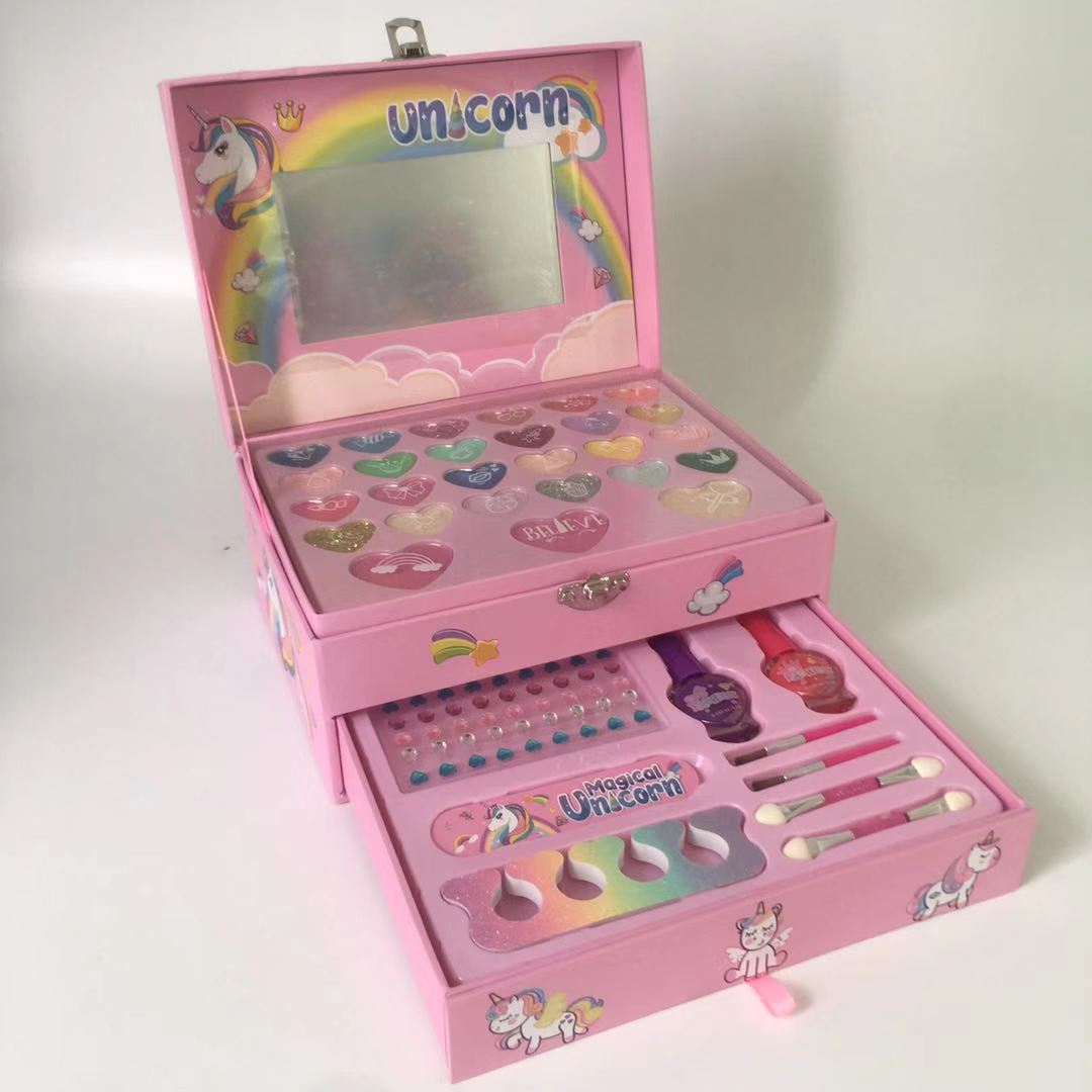 girl smiling while using makeup set