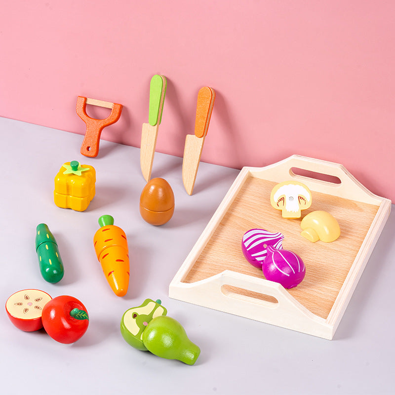 Child playing with magnetic wooden vegetable playset