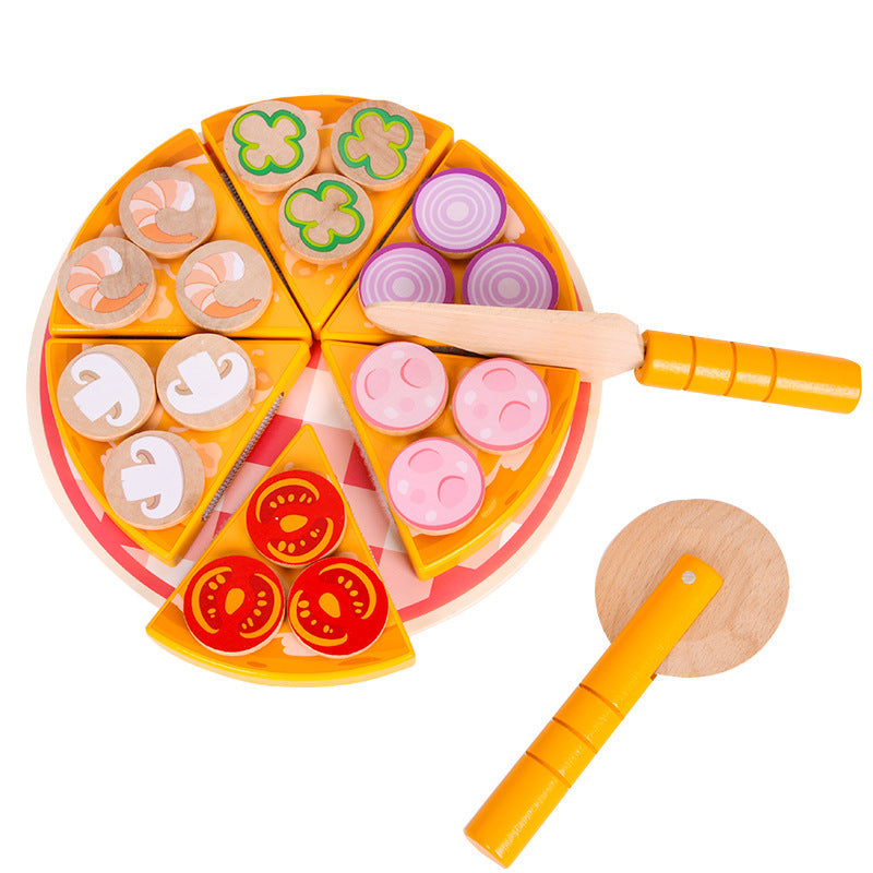 Child assembling pizza pieces from the toy kit