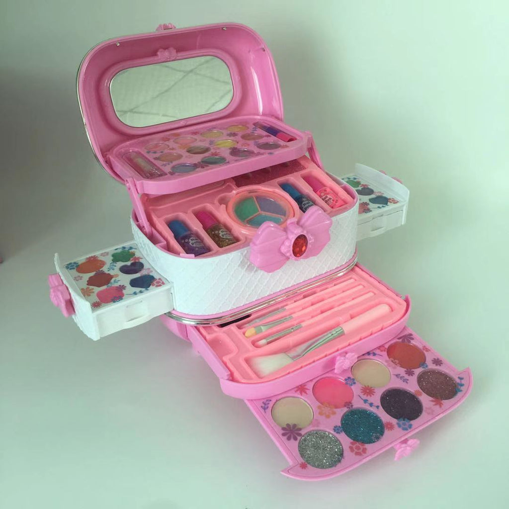 Child with blue makeup case showing vibrant cosmetics