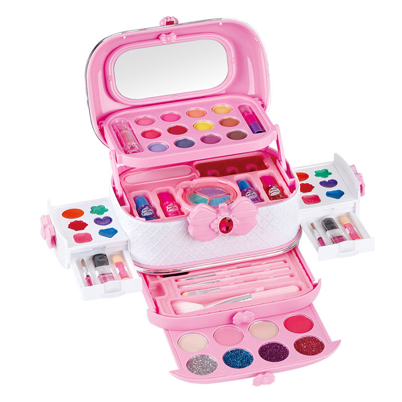 Child exploring makeup brushes in play kit