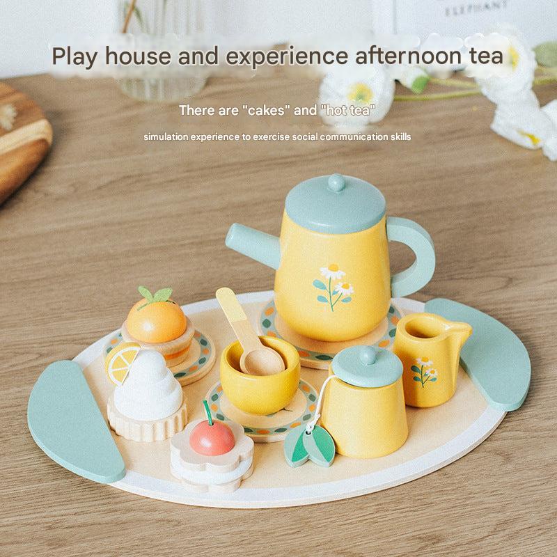 Child playing with wooden play kitchen set