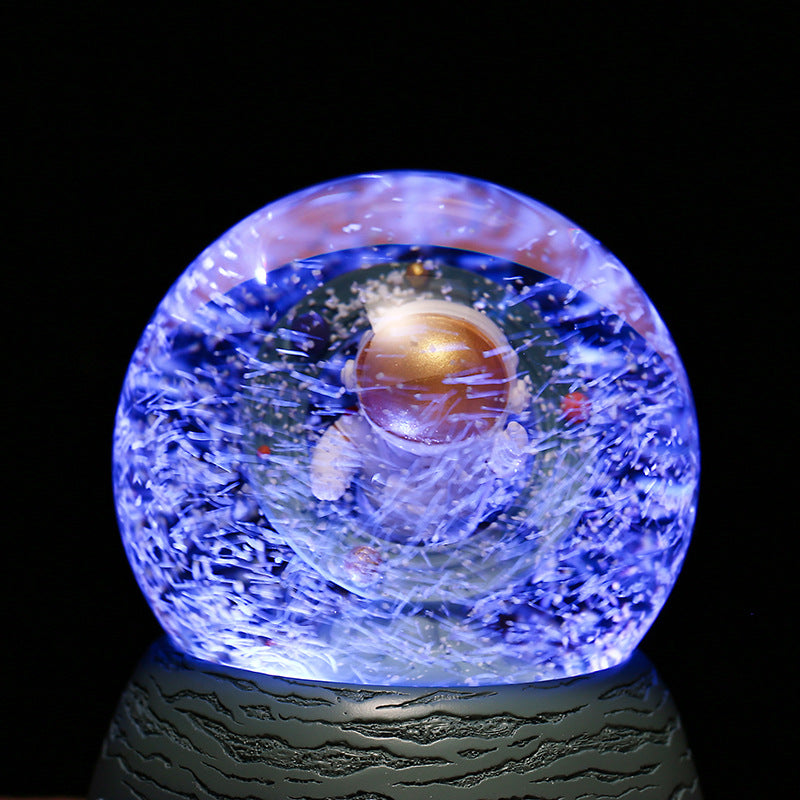 Decorative astronaut snow globe music piece