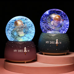 Astronaut snow globe music box with LEDs