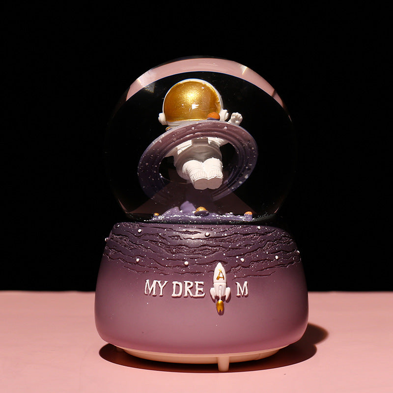 Astronaut snow globe displaying vibrant colours