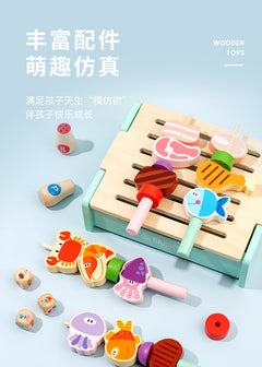 Child playing with wooden BBQ grill set