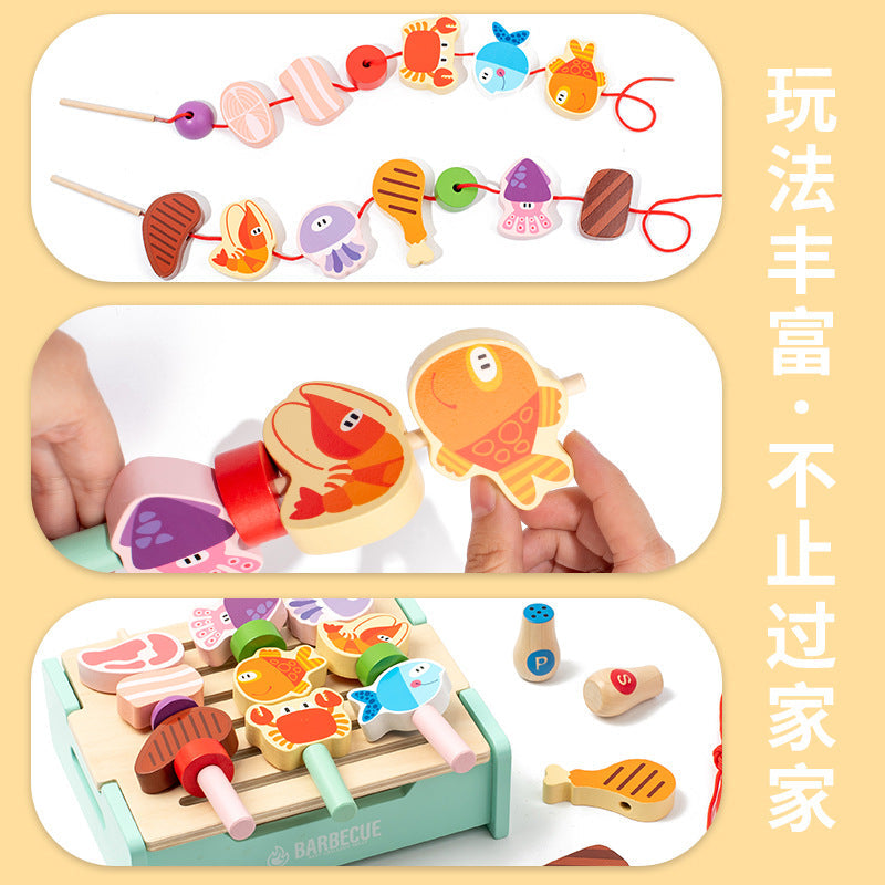 Child playing with wooden BBQ grill set