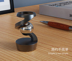 metallic spinning top toy displayed