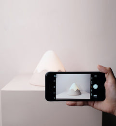 Rechargeable LED mountain lamp on bedside table