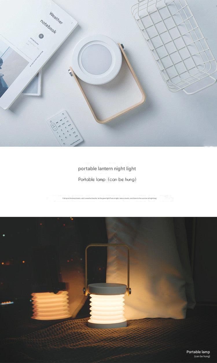 Folding LED lantern next to books on a desk
