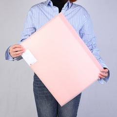 Person carrying A3 art folder outdoors