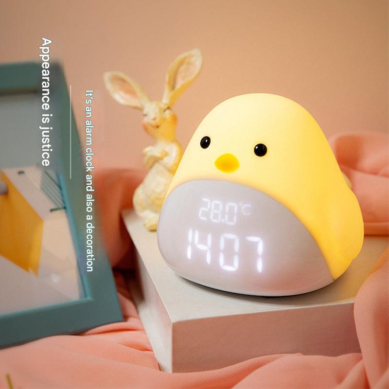 Kids digital alarm clock on bedside table