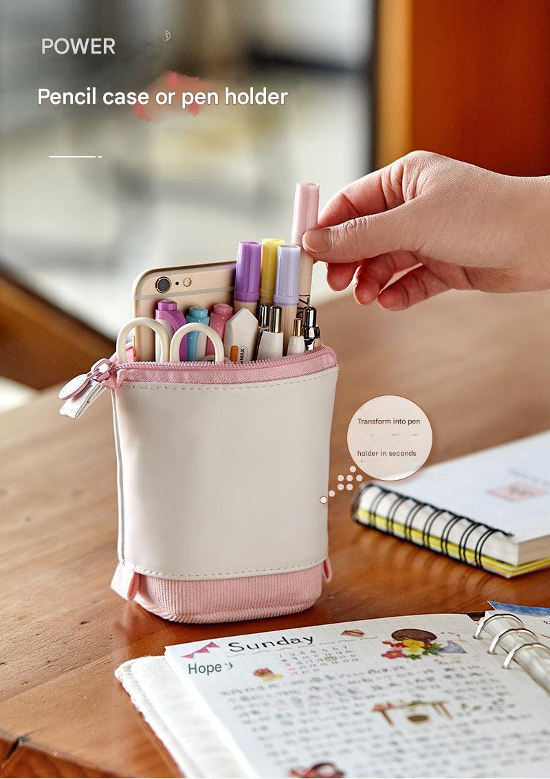 Corduroy pencil case display with writing tools