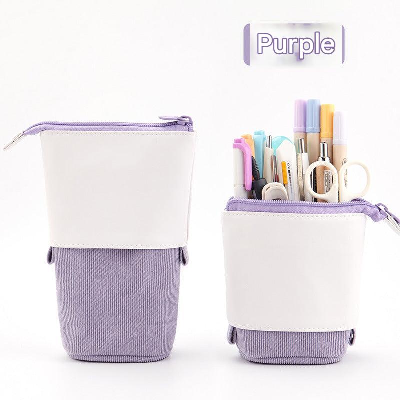 Set of colourful pencil cases on desk