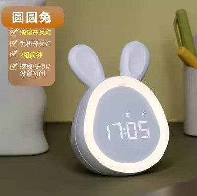 Pink bunny digital clock at night