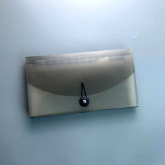 Detailed view of plastic document holder with 13 pockets