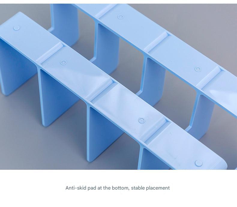 display of multi-slot acrylic organiser on desk