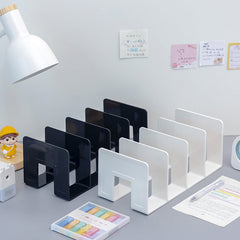 close-up view of multiple slots in acrylic book stand