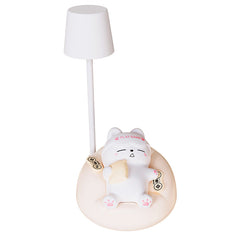 Eye-caring cat bedside lamp displayed in a bedroom