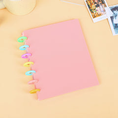 Open A4 photo album showing card slots in four-grid layout