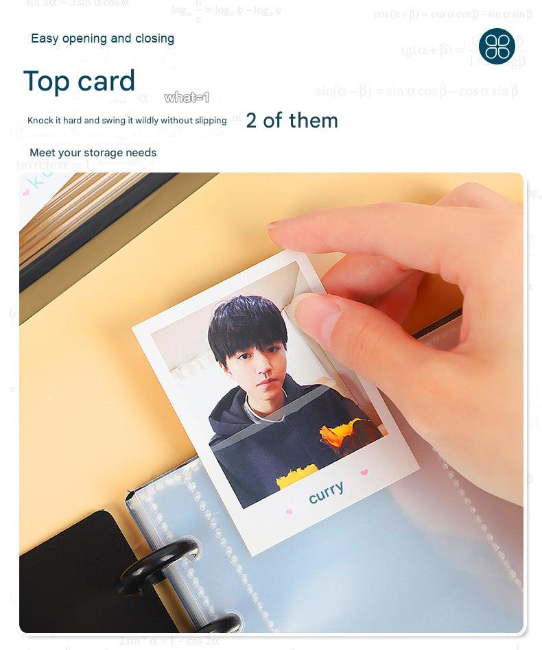 Open A4 photo album showing card slots in four-grid layout