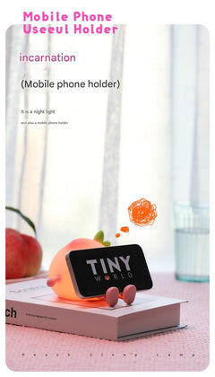 Close-up of multi-colour night light with phone stand