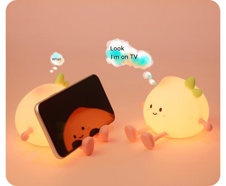 Child-friendly silicone night light displaying warm light