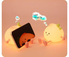 Child-friendly silicone night light displaying warm light