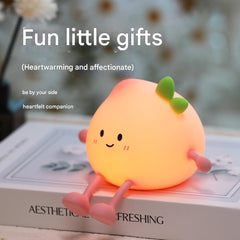 Close-up of multi-colour night light with phone stand