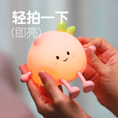 Child-friendly silicone night light displaying warm light