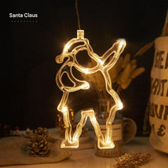 Fairy lights in window showing festive shapes