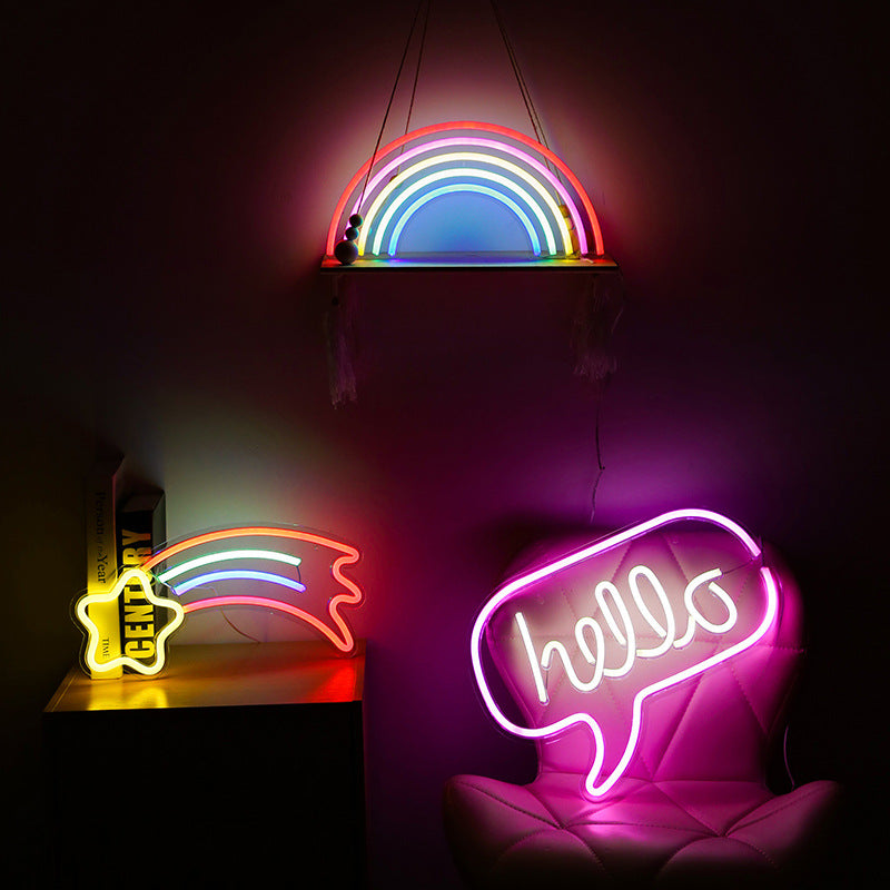 Neon sign with the word hello in bright colours