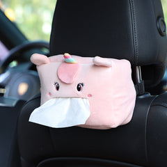 Plush lion tissue box dispenser in car interior