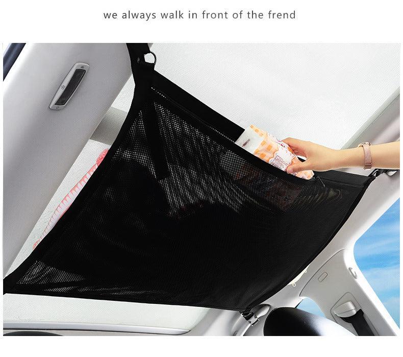 Car interior with ceiling storage net installed