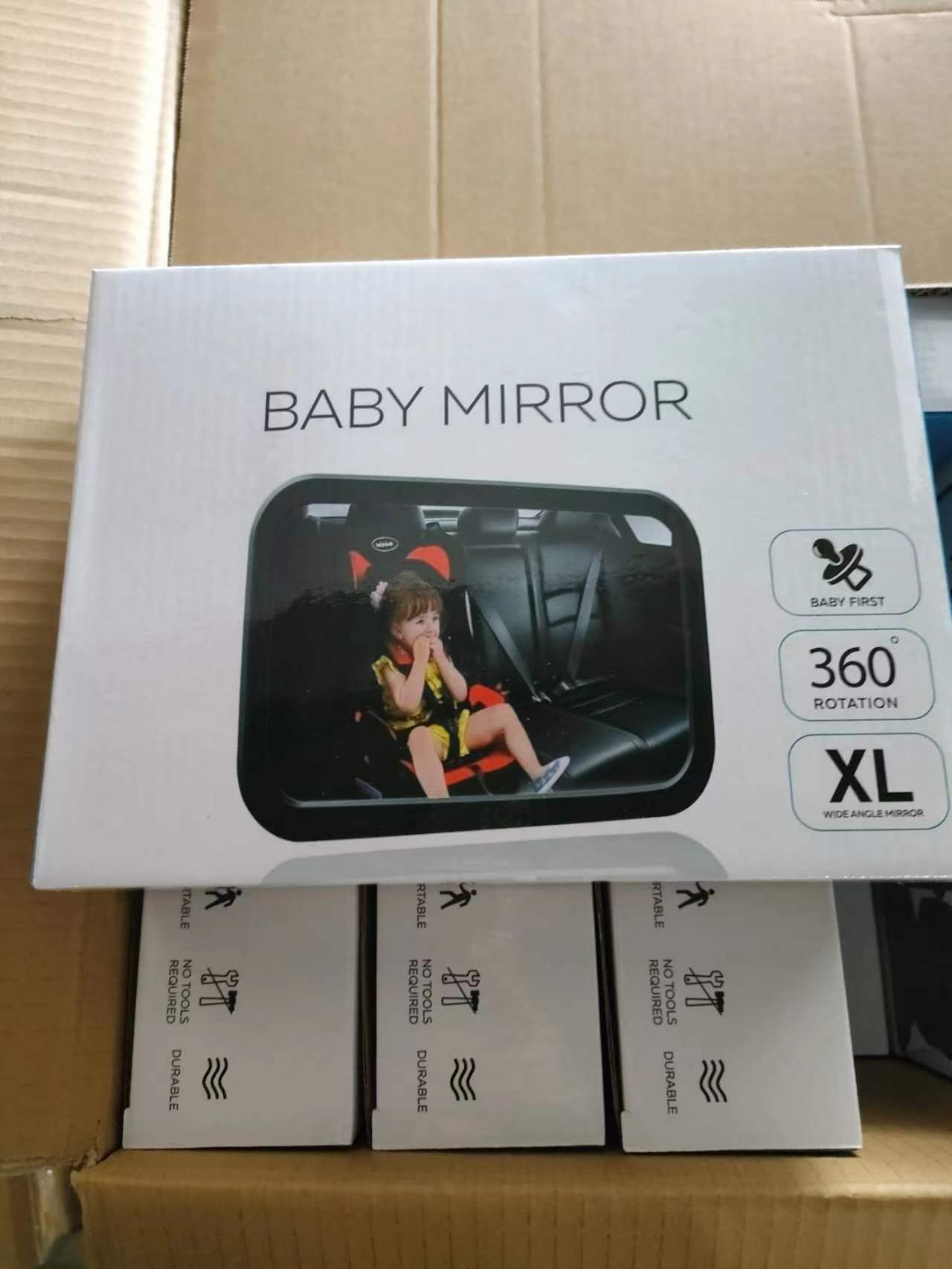 Profile view of baby in rear-facing car seat