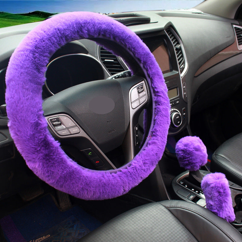 Pink plush steering wheel cover installed in vehicle