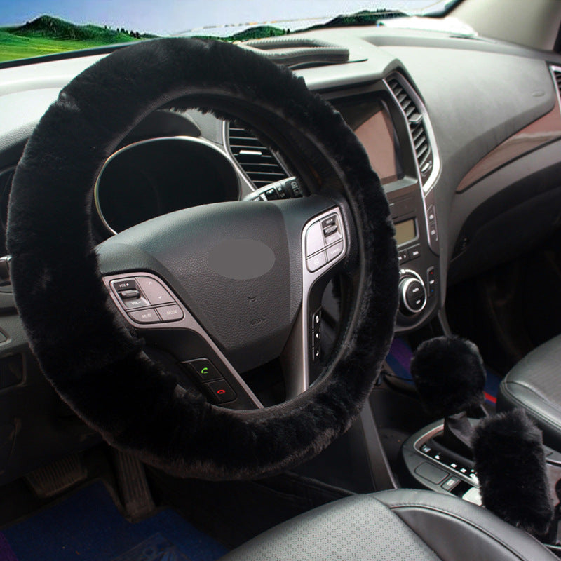 Red plush steering wheel cover accent in car