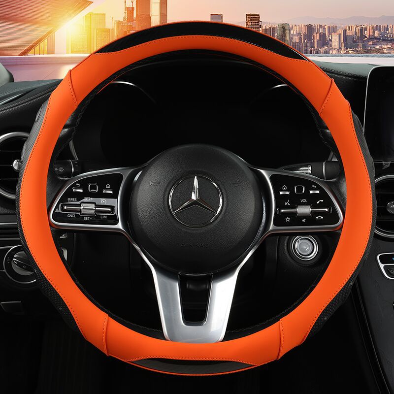 Black and blue steering wheel cover installed in a car