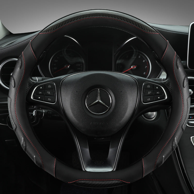 Black and blue steering wheel cover installed in a car