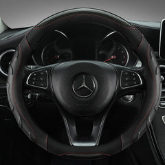 Black and blue steering wheel cover installed in a car