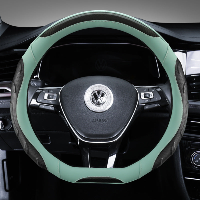Fitting black steering wheel cover on a car
