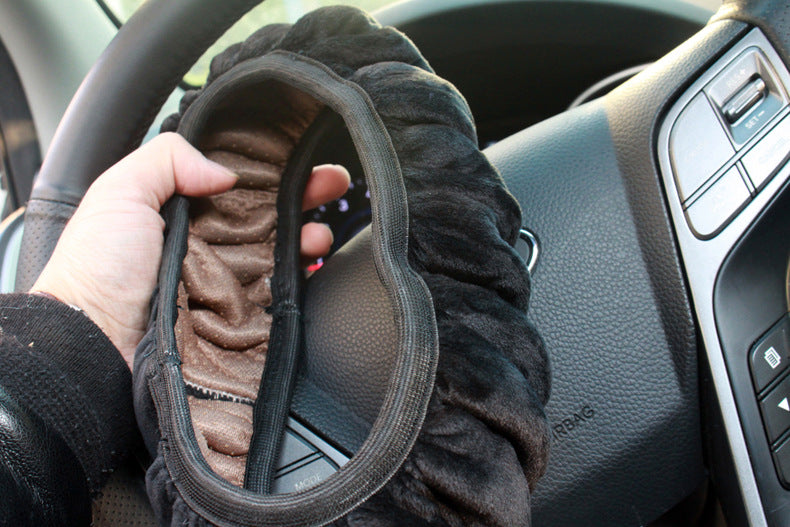 Close-up view of black steering wheel cover image 2