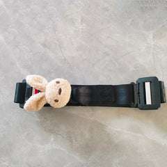 Folded maternity car safety belt beside car seat