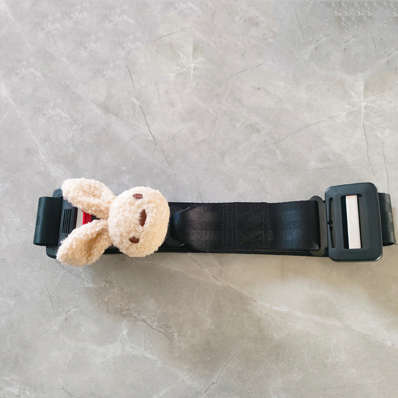 Folded maternity car safety belt beside car seat