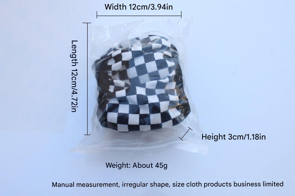 Detailed look at black and white checkered pattern steering wheel cover